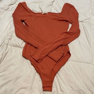 Orange ribbed bodysuit